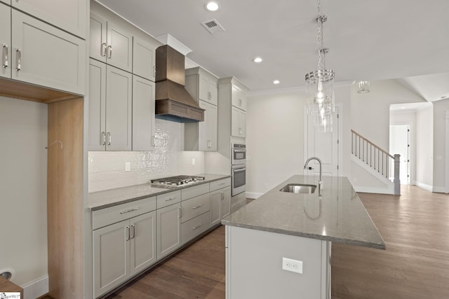 108 Cambie Pl, Greenville, SC 29607 - kitchen featuring premium range hood, stone counters, decorative backsplash, stainless steel appliances, and an island with sink