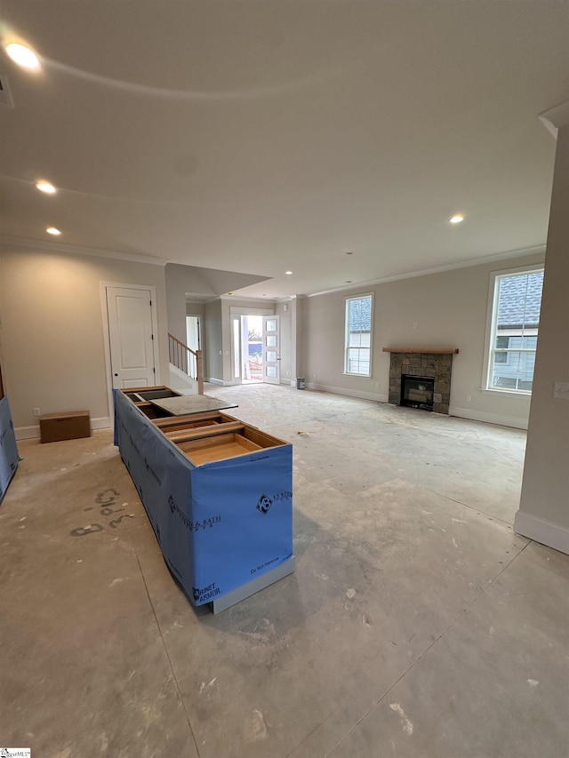 108 Cambie Pl, Greenville, SC 29607 - unfurnished living room featuring a tiled fireplace, unfinished concrete floors, and recessed lighting