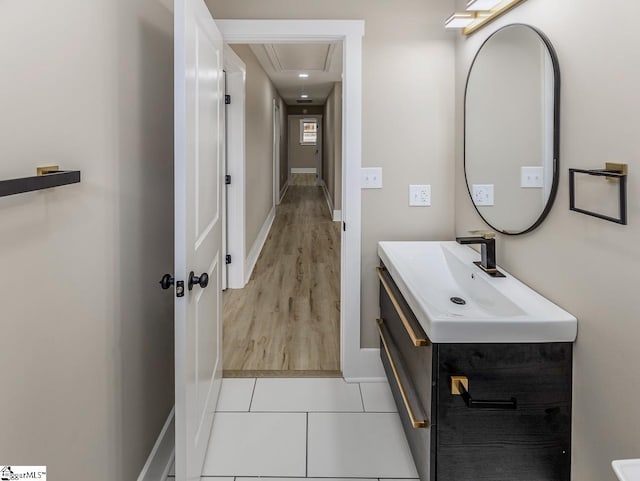 bathroom with vanity and hardwood / wood-style flooring