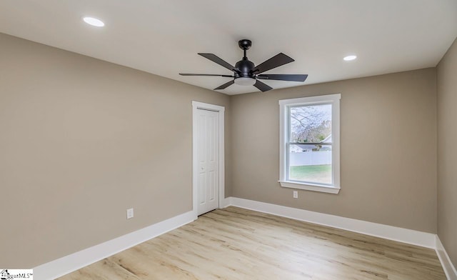 unfurnished bedroom featuring a closet, light hardwood / wood-style flooring, and ceiling fan