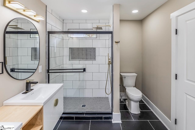 bathroom with toilet, vanity, tile patterned floors, and an enclosed shower