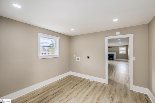 unfurnished room with light hardwood / wood-style flooring