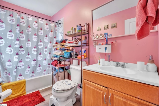 full bathroom with shower / bath combo, toilet, wood-type flooring, and vanity