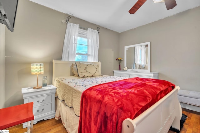 bedroom featuring ceiling fan and light hardwood / wood-style flooring