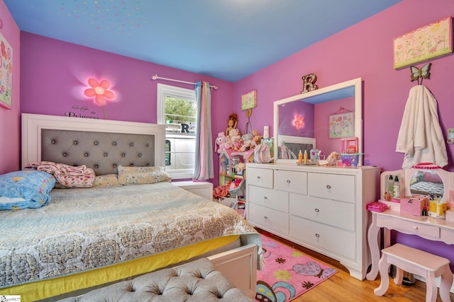 bedroom with light wood-type flooring