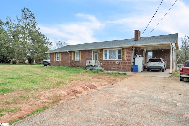 single story home with a front lawn and a carport