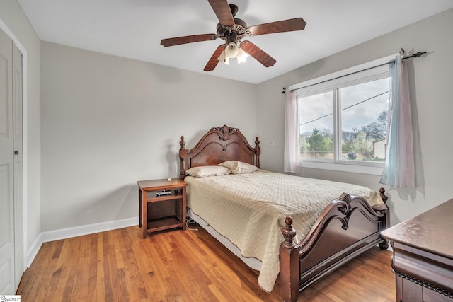 bedroom with ceiling fan and light wood-type flooring