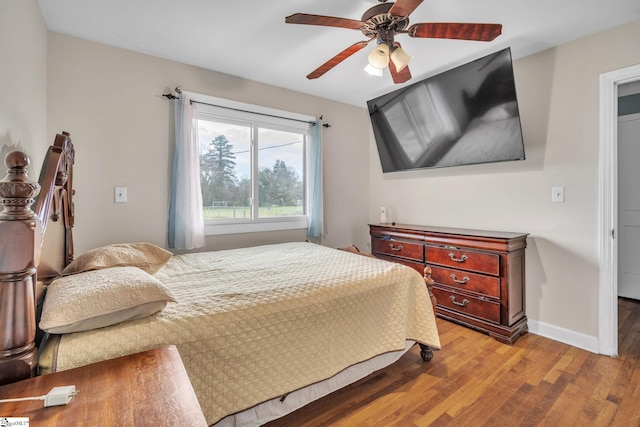 bedroom featuring ceiling fan and light hardwood / wood-style floors