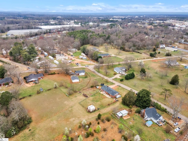 birds eye view of property with a rural view