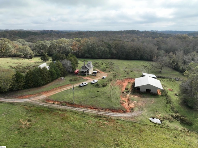 birds eye view of property with a rural view