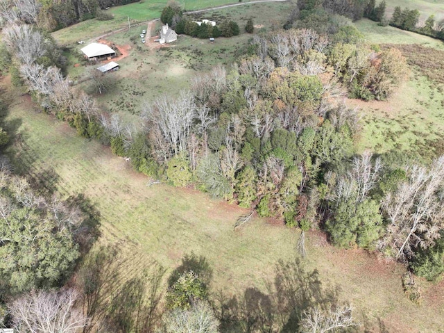 birds eye view of property with a rural view