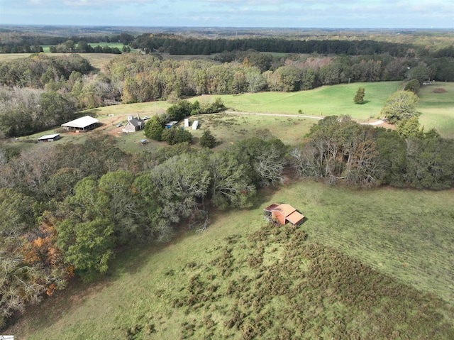 birds eye view of property with a rural view