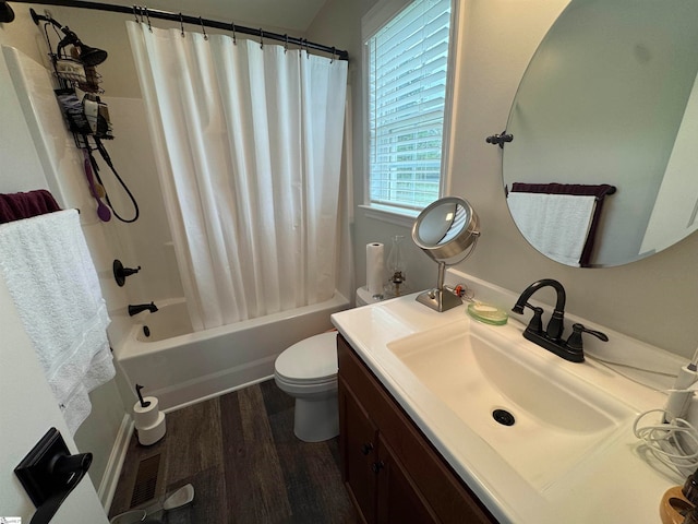 full bathroom featuring vanity, hardwood / wood-style flooring, toilet, and shower / bath combo with shower curtain