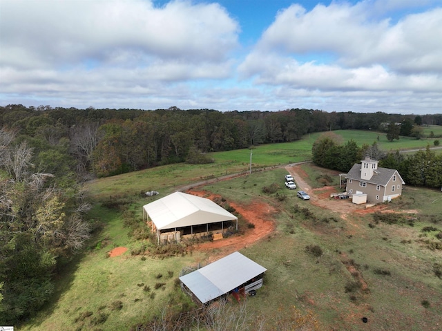 birds eye view of property with a rural view