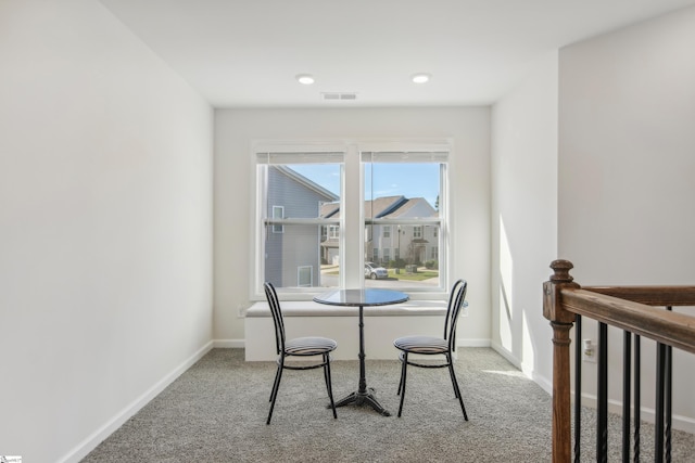 dining area with light carpet