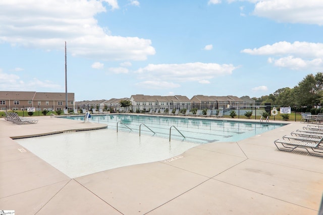 view of swimming pool featuring a patio