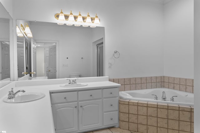 bathroom featuring vanity, crown molding, tile patterned flooring, a relaxing tiled tub, and toilet