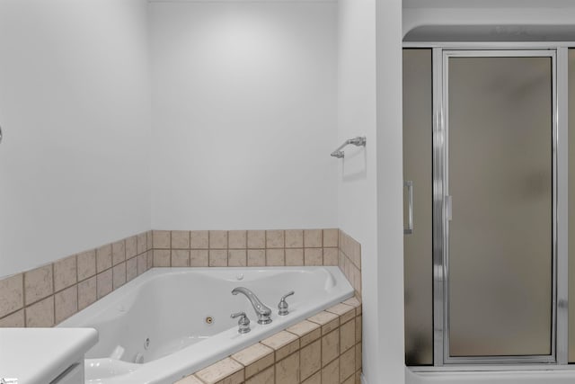 bathroom with shower with separate bathtub and vanity