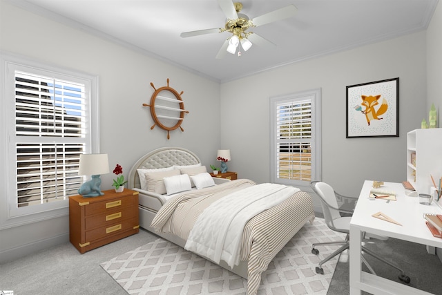 carpeted bedroom featuring ceiling fan and crown molding