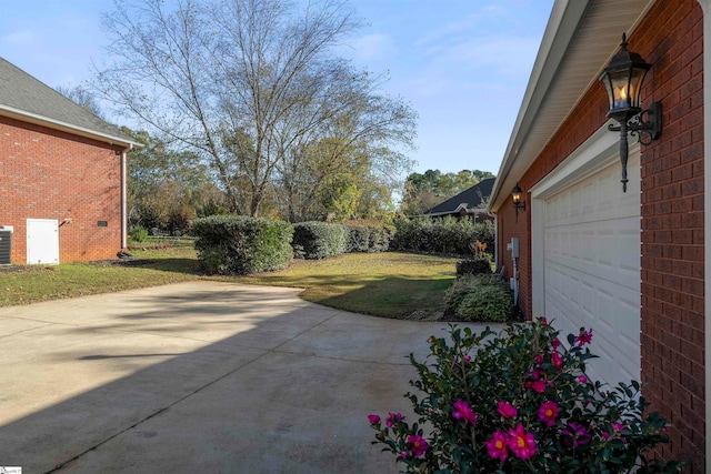 view of patio featuring a garage and central air condition unit