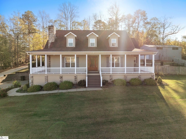 view of front facade with covered porch and a front yard