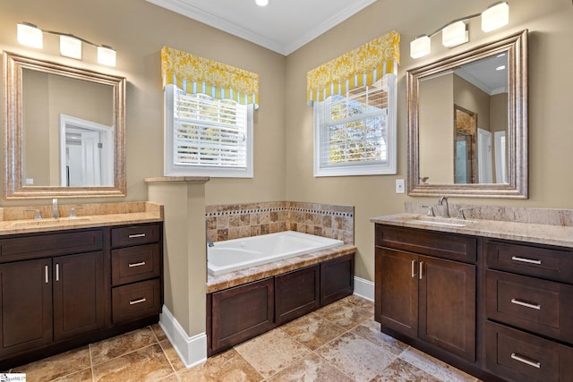 bathroom with vanity, a tub to relax in, and crown molding