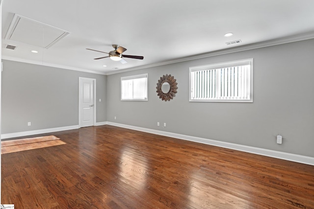 empty room with ceiling fan, dark hardwood / wood-style flooring, and crown molding