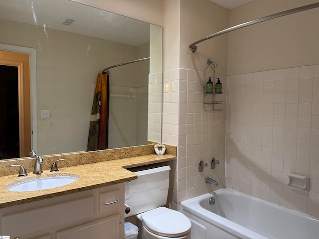 full bathroom with shower / bath combo with shower curtain, vanity, and toilet