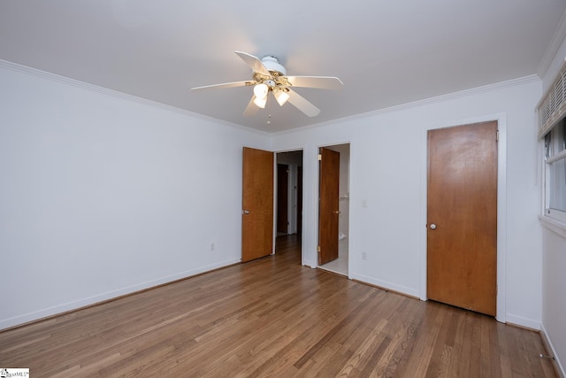 unfurnished bedroom featuring hardwood / wood-style flooring, crown molding, and ceiling fan