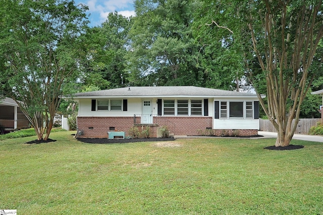 single story home with a front yard