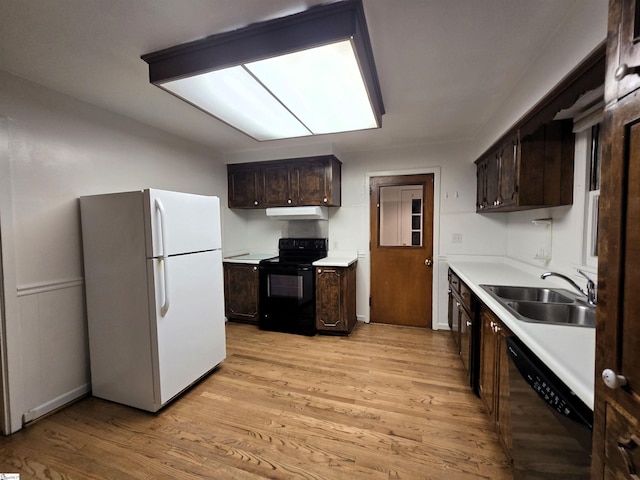 kitchen with sink, dark brown cabinetry, black / electric stove, stainless steel dishwasher, and white fridge