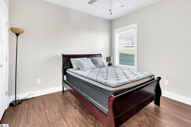 bedroom with hardwood / wood-style flooring and ceiling fan