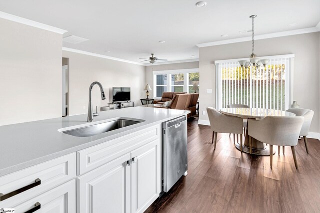 kitchen with dishwasher, sink, dark hardwood / wood-style floors, decorative light fixtures, and white cabinetry