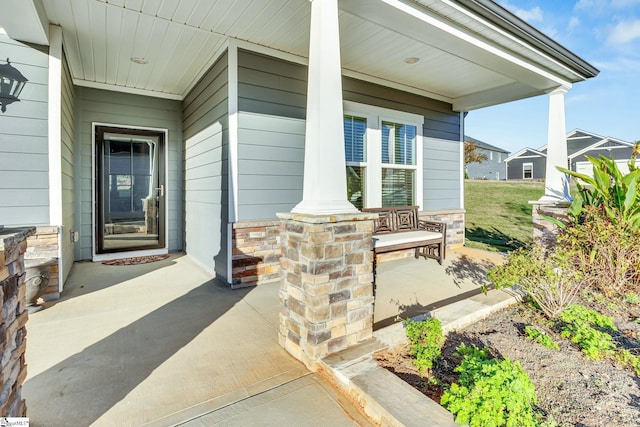 entrance to property featuring a porch