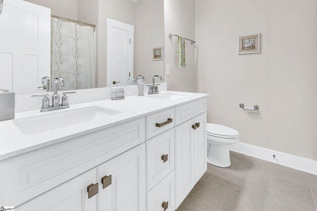 bathroom featuring walk in shower, tile patterned flooring, vanity, and toilet