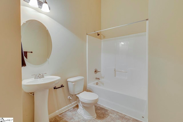 full bathroom with sink, bathtub / shower combination, and toilet