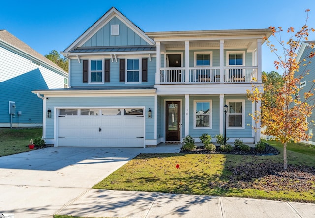 view of front of home with a garage and a front lawn