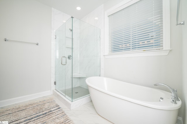 bathroom with shower with separate bathtub