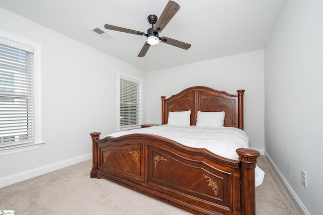 bedroom with ceiling fan and light colored carpet