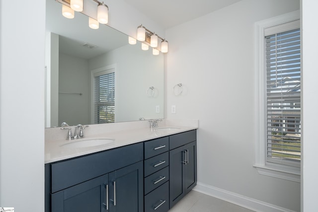 bathroom featuring tile patterned flooring and vanity