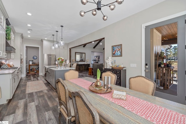 dining space featuring beamed ceiling, a notable chandelier, and dark wood-type flooring