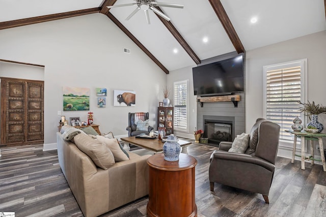 living room with beamed ceiling, a large fireplace, high vaulted ceiling, and dark wood-type flooring