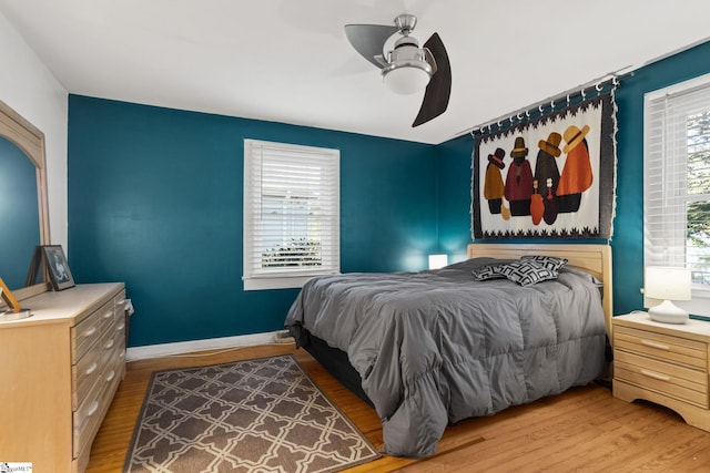 bedroom featuring hardwood / wood-style floors and ceiling fan