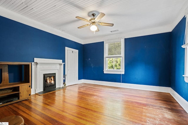 unfurnished living room with hardwood / wood-style floors, ceiling fan, crown molding, and wood ceiling