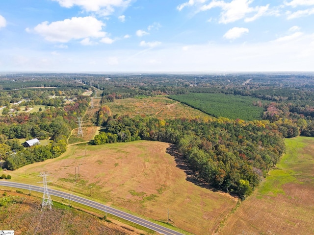 birds eye view of property with a rural view