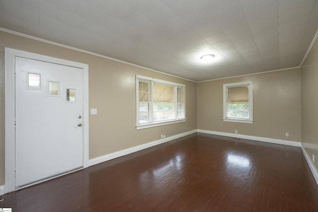 entrance foyer with dark hardwood / wood-style flooring and ornamental molding