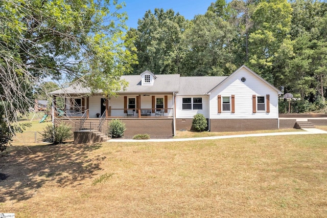 view of front of home with covered porch and a front yard