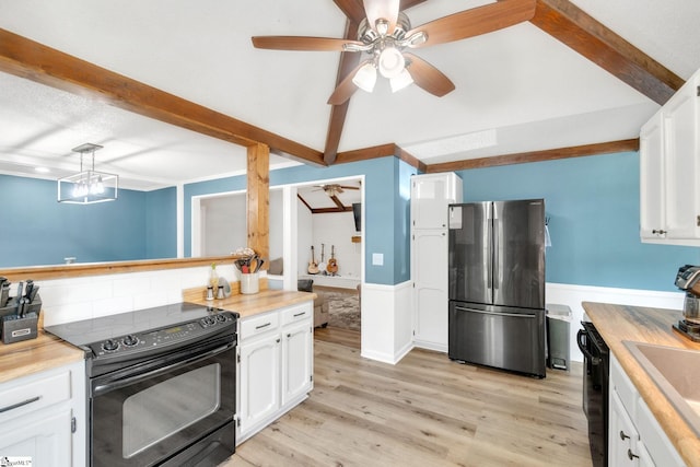 kitchen featuring white cabinets, beam ceiling, light hardwood / wood-style flooring, and black appliances