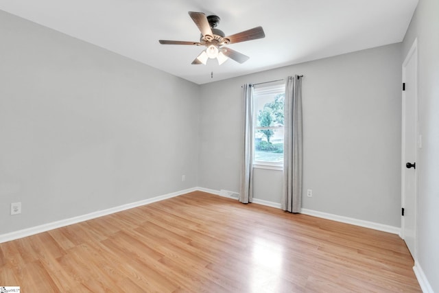 spare room with ceiling fan and light hardwood / wood-style flooring