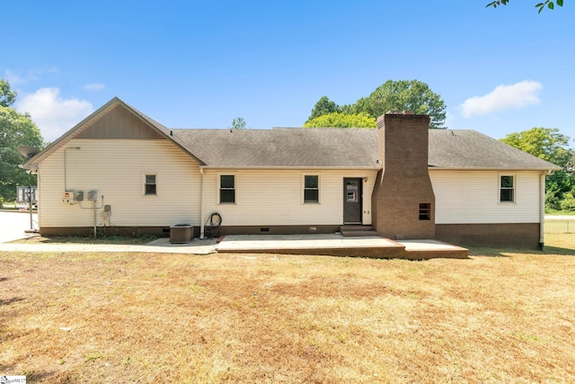 rear view of property featuring a patio area and a yard